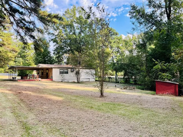 a house with trees in the background