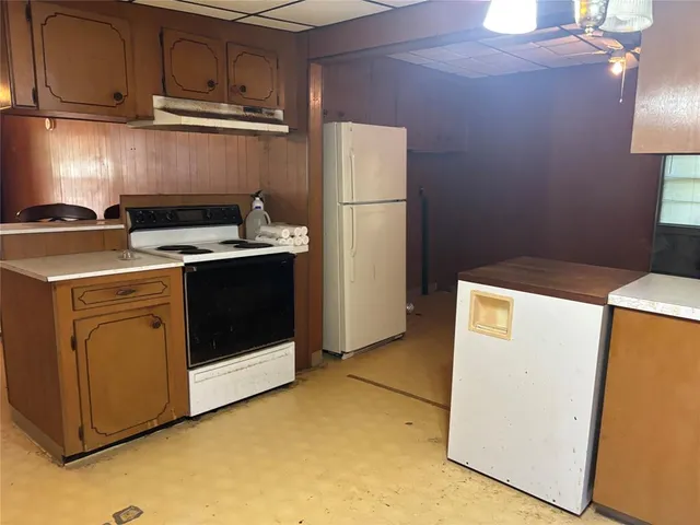 a kitchen with a stove and a sink