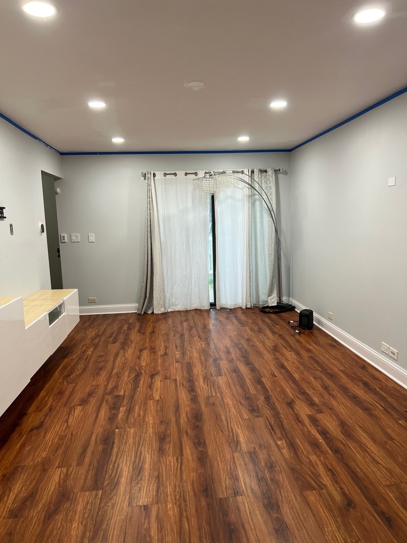 641 Surfside Point, Unit 641 Schaumburg, IL 60194 - Photo 6 of 18 a view of a room with wooden floor