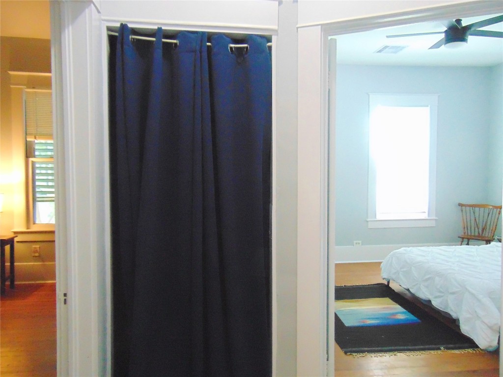 3420 Avenue R Galveston, TX 77550 - Photo 12 of 36 a bedroom with a bed and a mirror