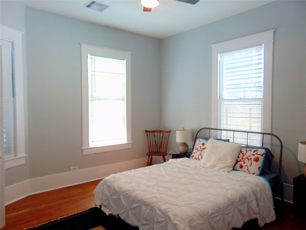 3420 Avenue R Galveston, TX 77550 - Photo 15 of 36 a bedroom with a bed and a window