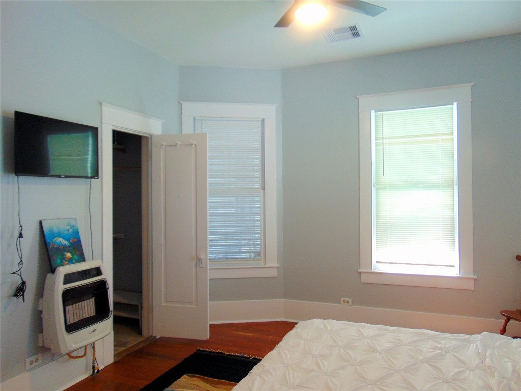 3420 Avenue R Galveston, TX 77550 - Photo 16 of 36 a bedroom with a bed and a window