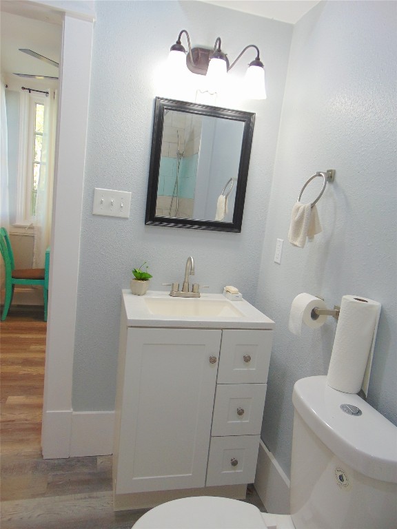 3420 Avenue R Galveston, TX 77550 - Photo 25 of 36 a bathroom with a toilet sink and mirror