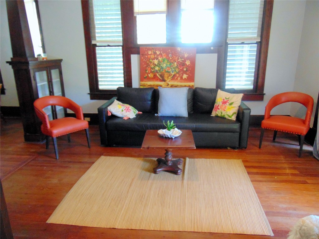 3420 Avenue R Galveston, TX 77550 - Photo 5 of 36 a living room with furniture a rug and a large window