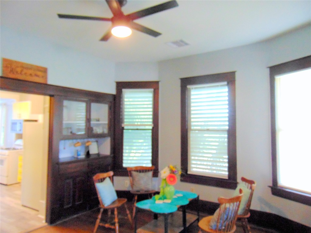 3420 Avenue R Galveston, TX 77550 - Photo 6 of 36 a view of a dining room with furniture window and outside view