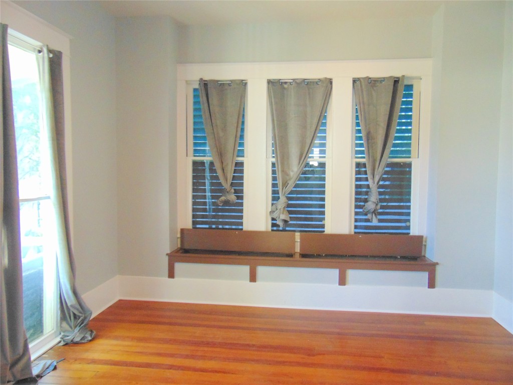 3420 Avenue R Galveston, TX 77550 - Photo 7 of 36 a view of wooden floor and windows in a room