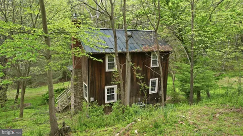 front view of a house with a tree