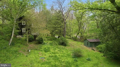 a backyard of a house with lots of green space