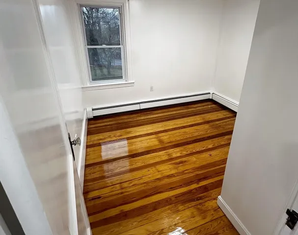 a bedroom with a bed and the view of mirror