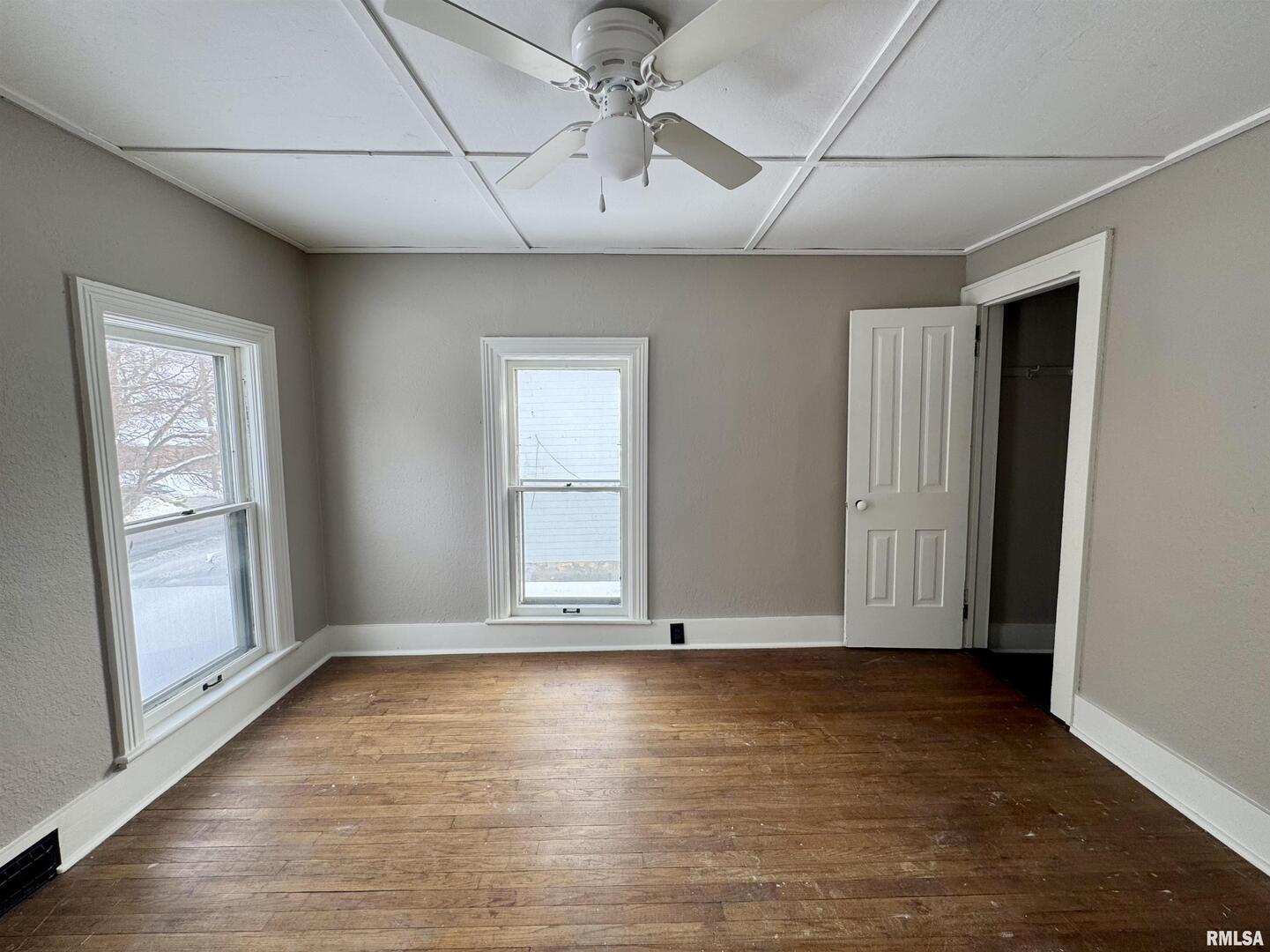 609 5th Avenue South Clinton, IA 52732 - Photo 14 of 25 a view of room with window and hardwood floor