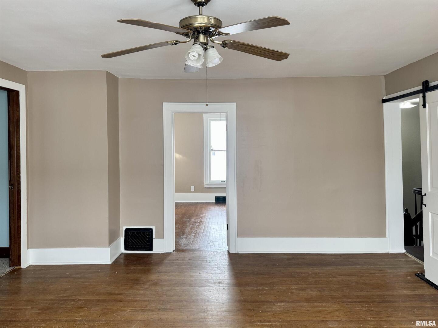 609 5th Avenue South Clinton, IA 52732 - Photo 18 of 25 a view of empty room with wooden floor