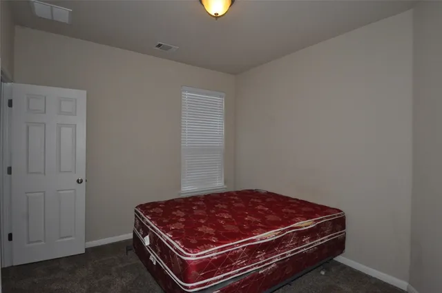 a room with a bed and a window