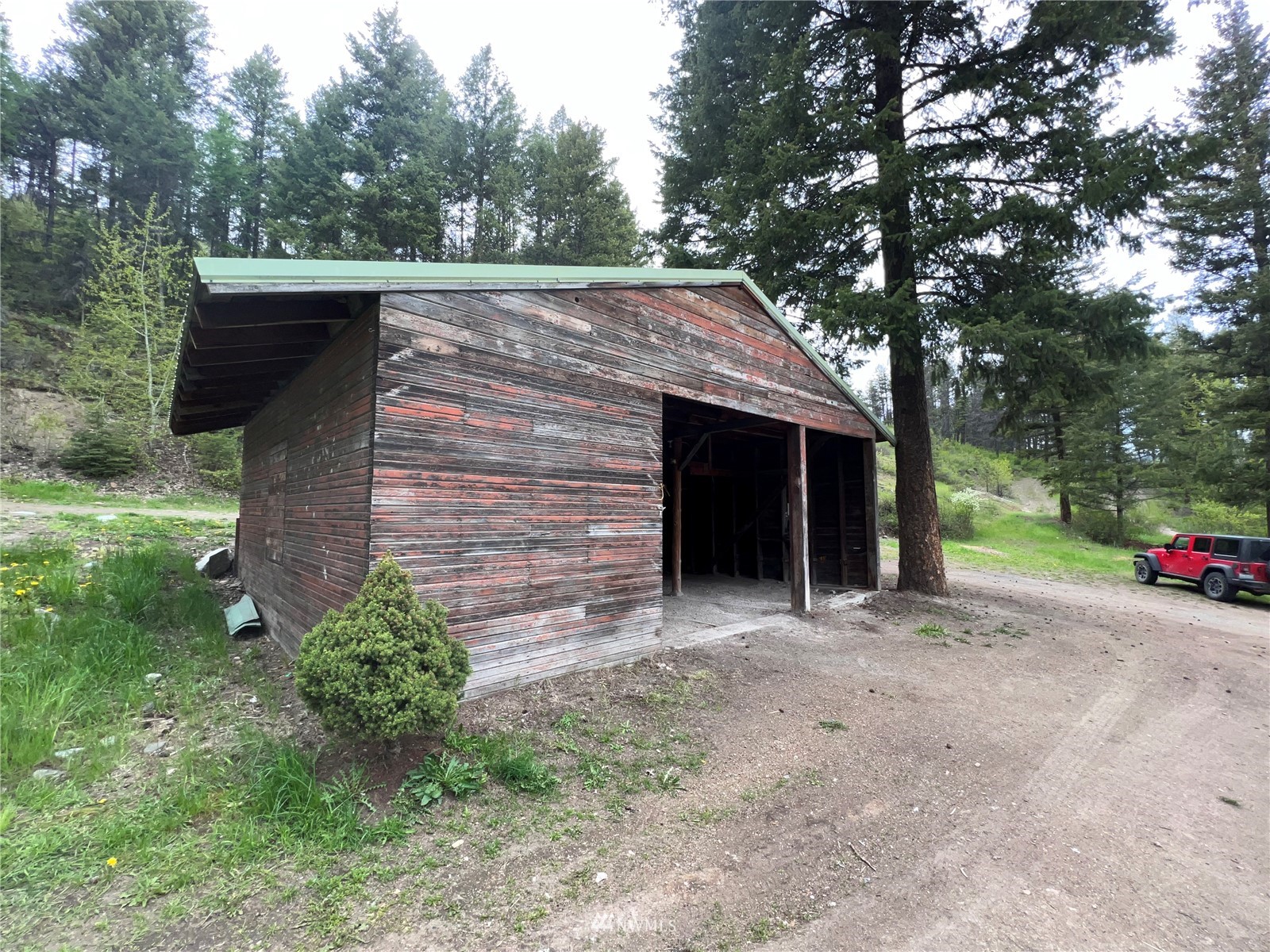 2 Hidden Falls Spur Road Republic, WA 99166 - Photo 15 of 26 a front view of a house with a yard