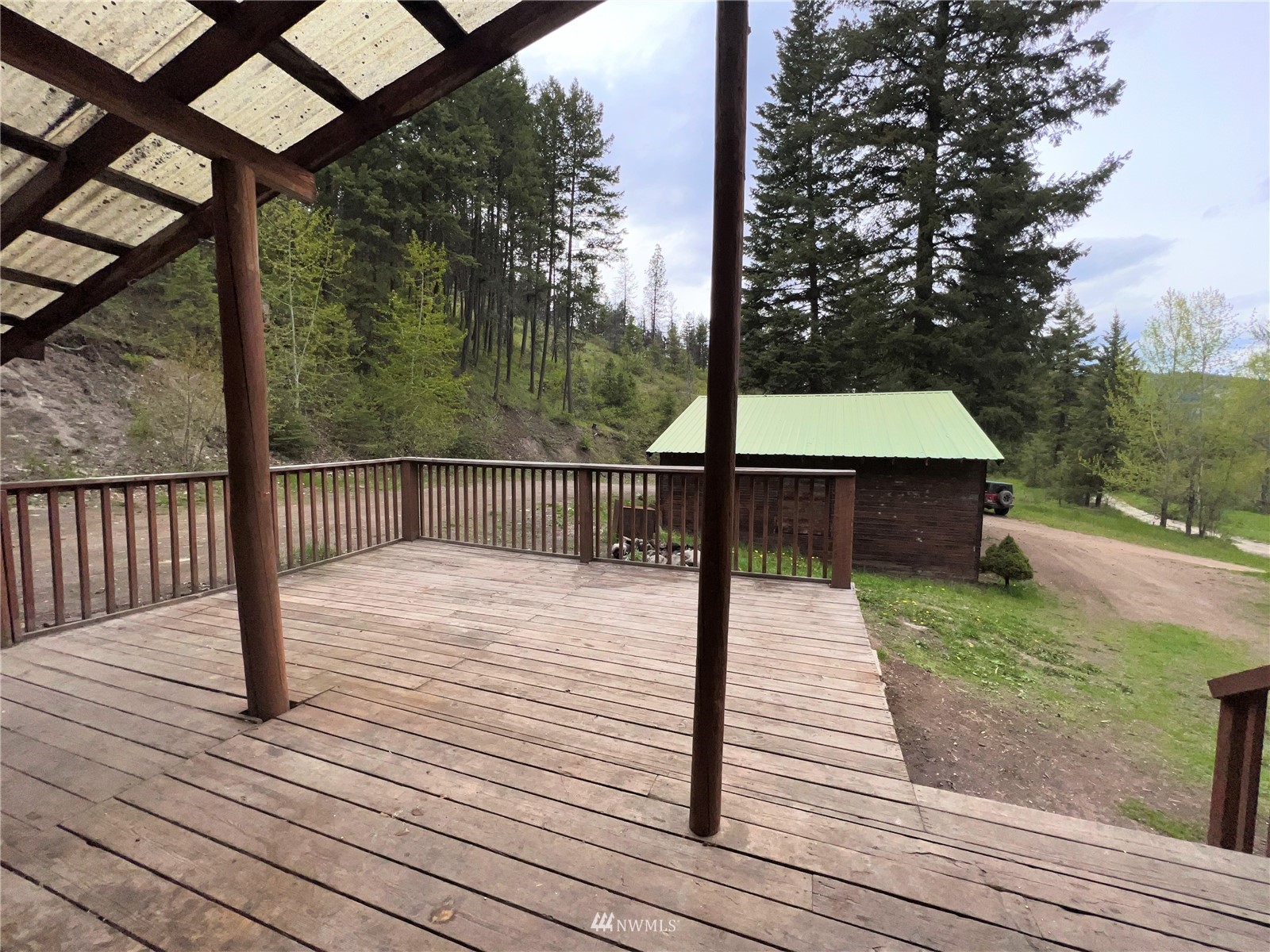 2 Hidden Falls Spur Road Republic, WA 99166 - Photo 20 of 26 a deck view with wooden floor and fence