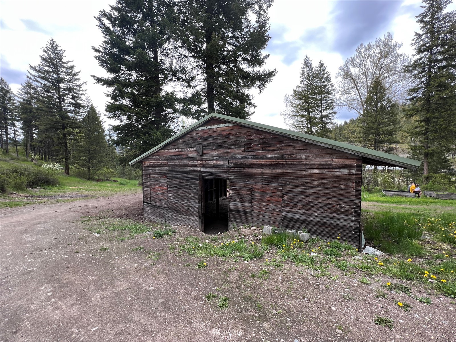 2 Hidden Falls Spur Road Republic, WA 99166 - Photo 26 of 26 a view of a wooden house with a yard and large trees