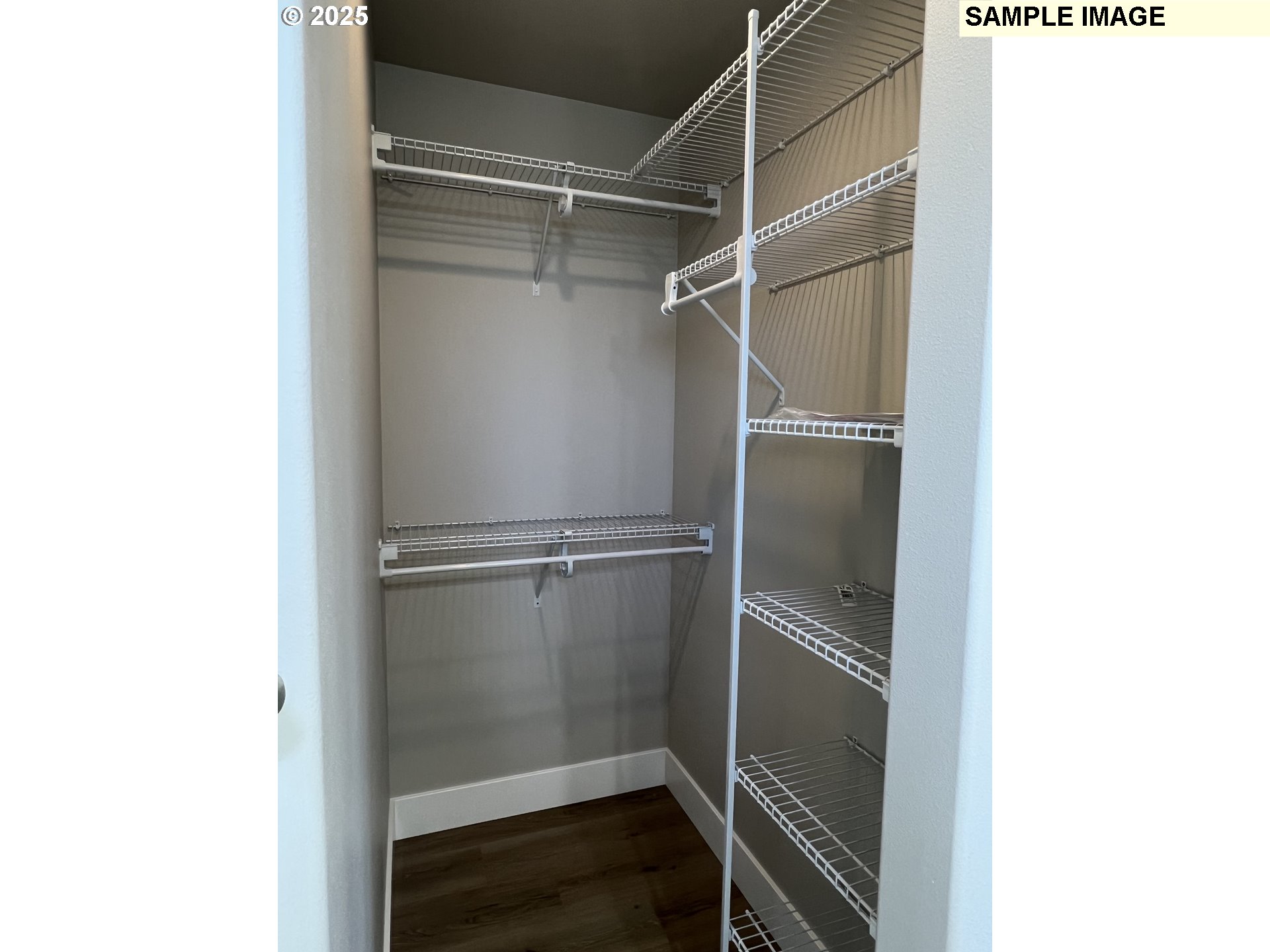 119 Lebleu Lane Winston, OR 97496 - Photo 12 of 30 a walk in closet with wooden floor