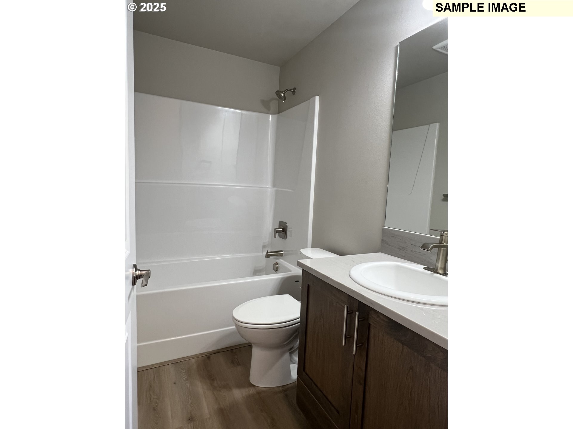 119 Lebleu Lane Winston, OR 97496 - Photo 17 of 30 a bathroom with a granite countertop toilet a sink and a bathtub