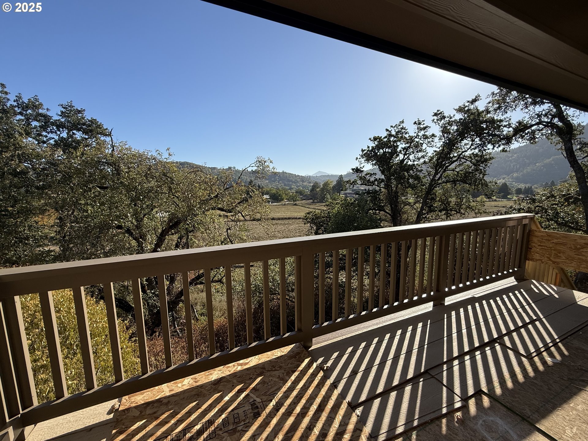 119 Lebleu Lane Winston, OR 97496 - Photo 20 of 30 a balcony with wooden floor and fence