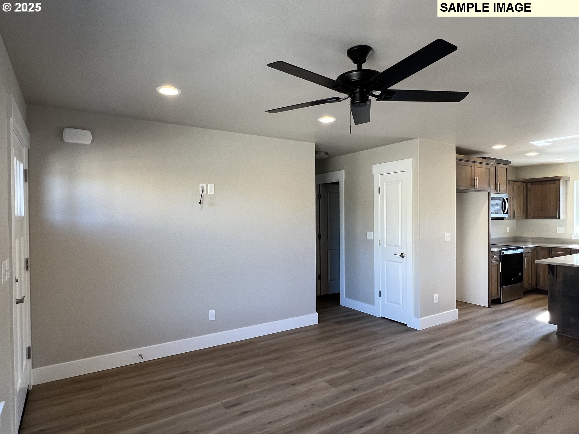 119 Lebleu Lane Winston, OR 97496 - Photo 4 of 30 a view of empty room with wooden floor and ceiling fan