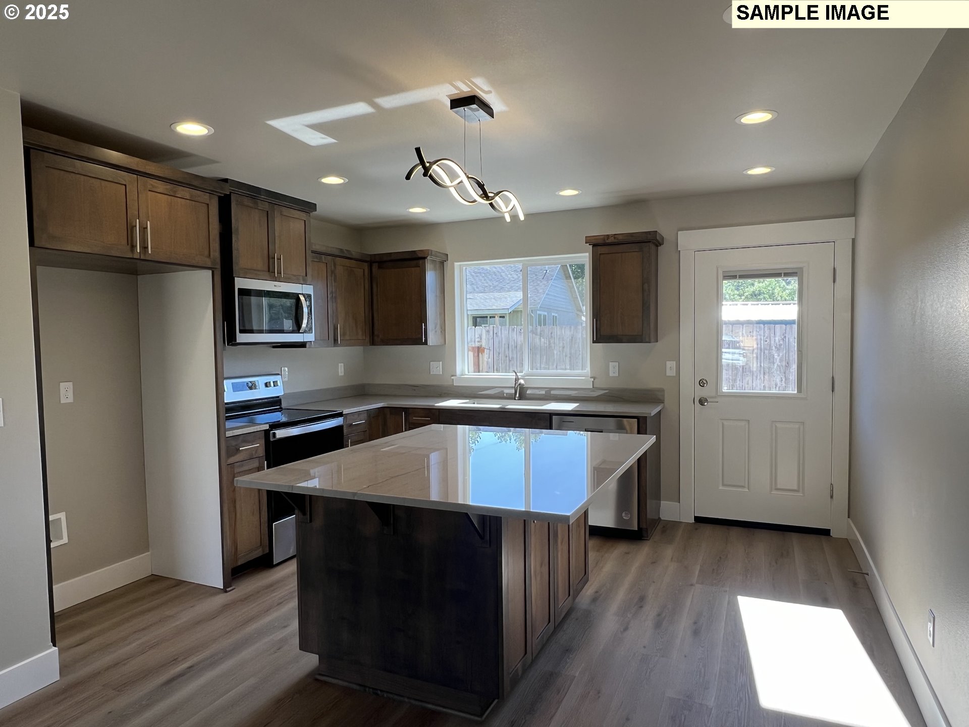 119 Lebleu Lane Winston, OR 97496 - Photo 5 of 30 a kitchen with kitchen island a sink stainless steel appliances and cabinets