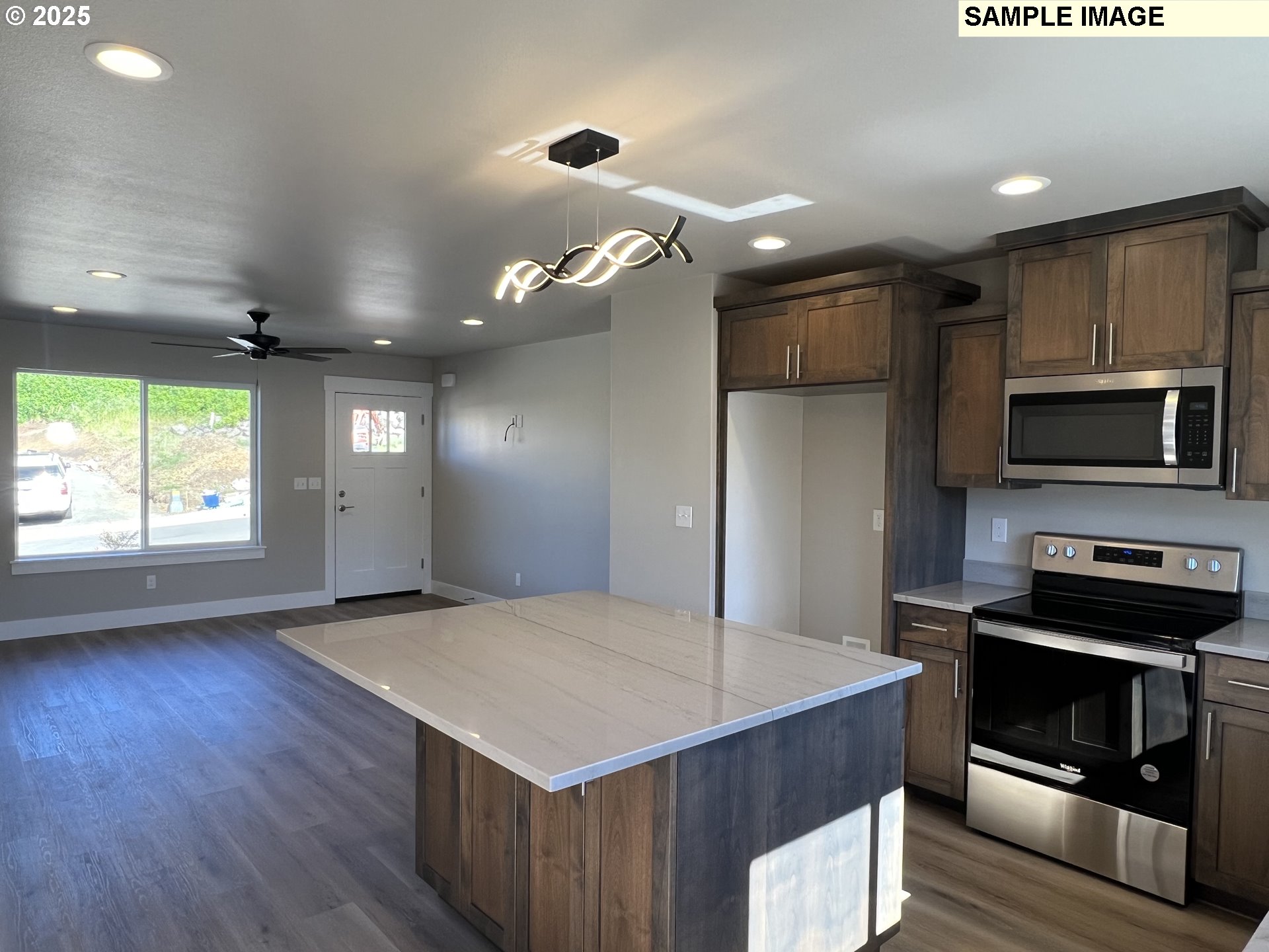 119 Lebleu Lane Winston, OR 97496 - Photo 6 of 30 a kitchen with kitchen island a counter space a sink appliances and cabinets