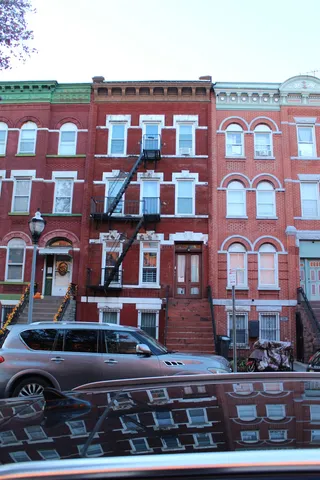 a front view of a building with balcony