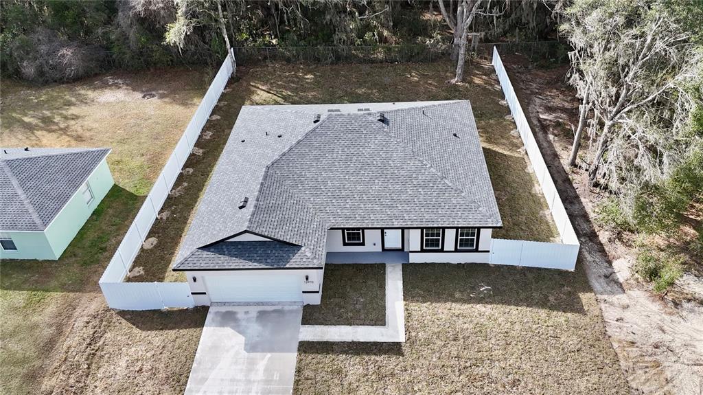 12970 Southwest 43rd Ave Road Ocala, FL 34473 - Photo 2 of 44 an aerial view of a house with a yard