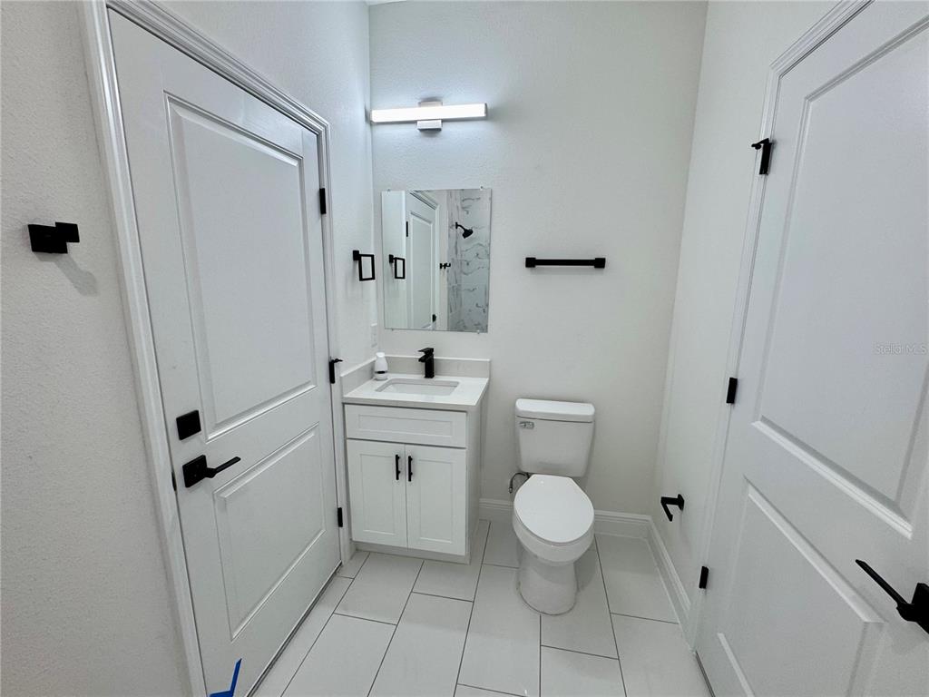 12970 Southwest 43rd Ave Road Ocala, FL 34473 - Photo 21 of 44 a bathroom with a sink toilet and shower