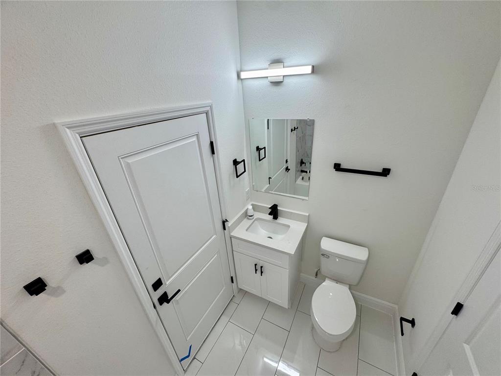12970 Southwest 43rd Ave Road Ocala, FL 34473 - Photo 23 of 44 a bathroom with a sink a toilet and shower