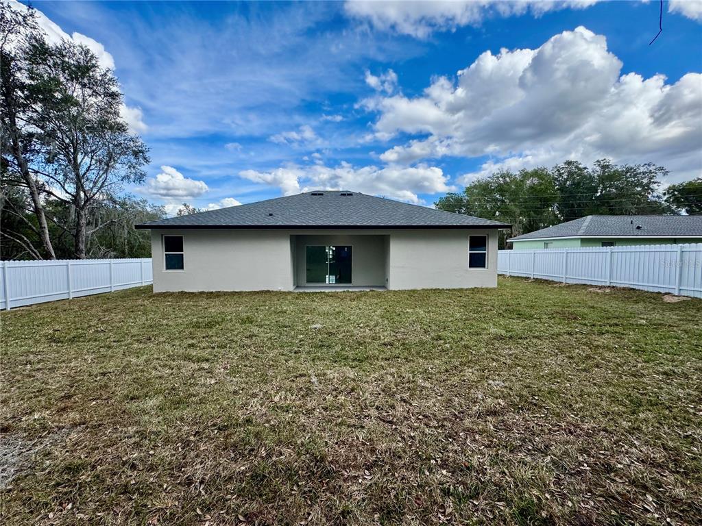 12970 Southwest 43rd Ave Road Ocala, FL 34473 - Photo 26 of 44 a backyard of a house with lots of green space