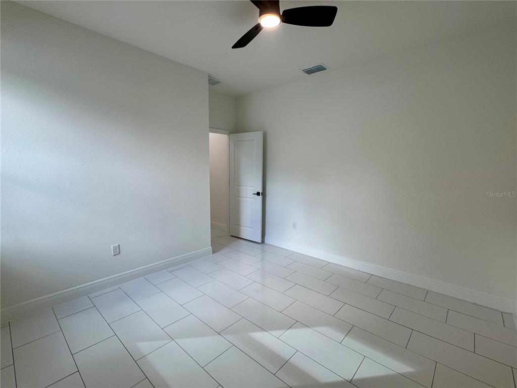 12970 Southwest 43rd Ave Road Ocala, FL 34473 - Photo 33 of 44 an empty room with chandelier fan