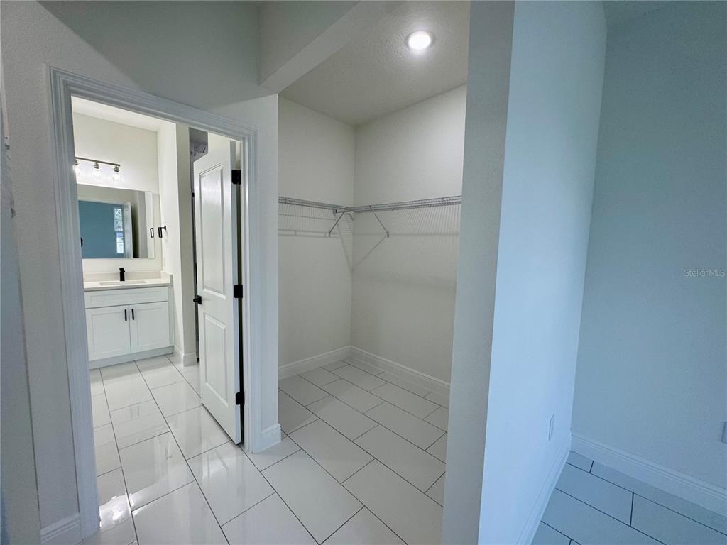 12970 Southwest 43rd Ave Road Ocala, FL 34473 - Photo 10 of 44 a bathroom with a glass shower door and a sink