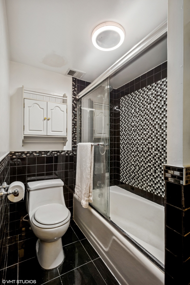 205 Ridge Road, Unit 204 Wilmette, IL 60091 - Photo 11 of 16 a bathroom with a toilet and a shower