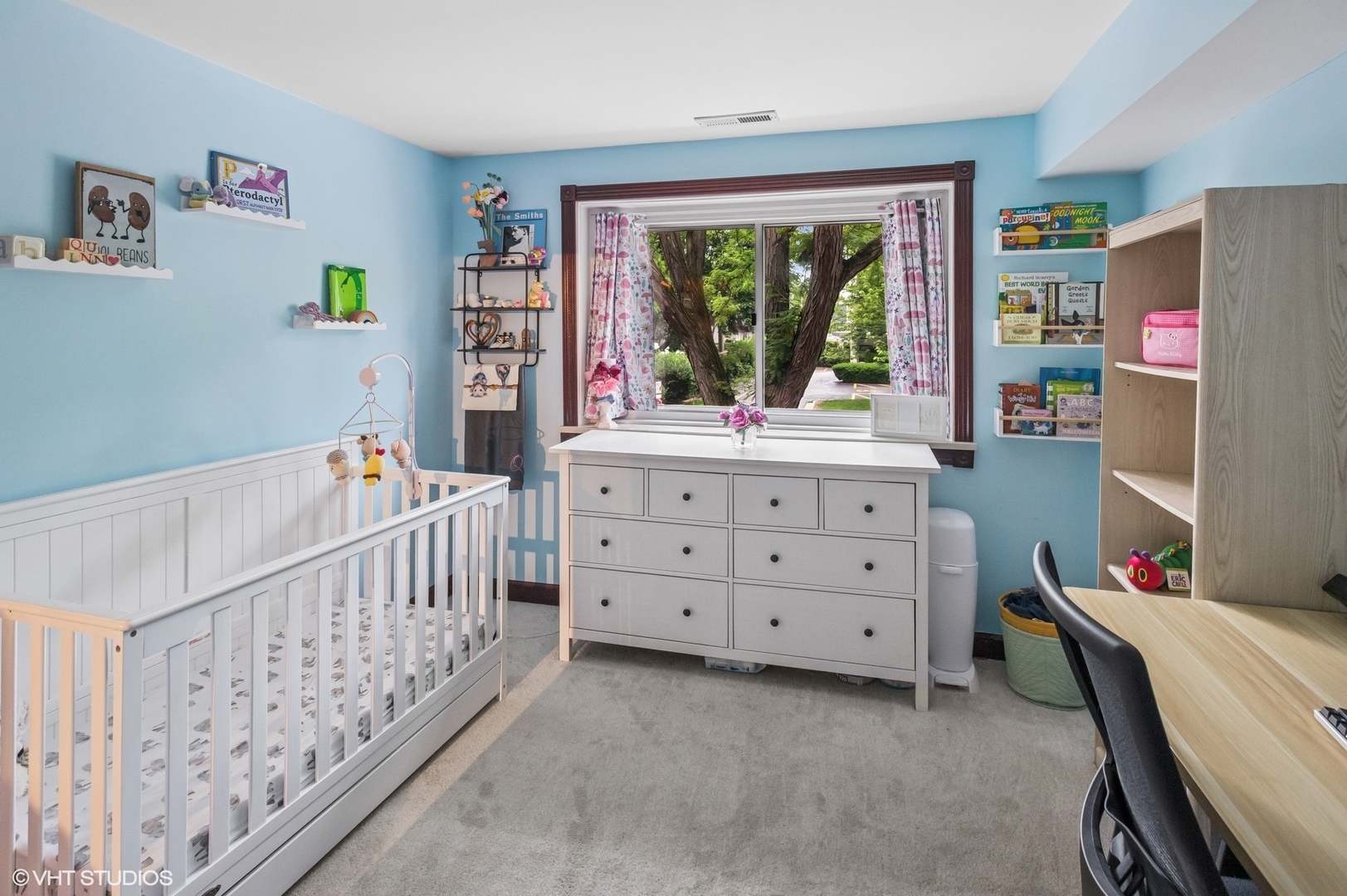 205 Ridge Road, Unit 204 Wilmette, IL 60091 - Photo 13 of 16 a bedroom with furniture a baby crib and a window