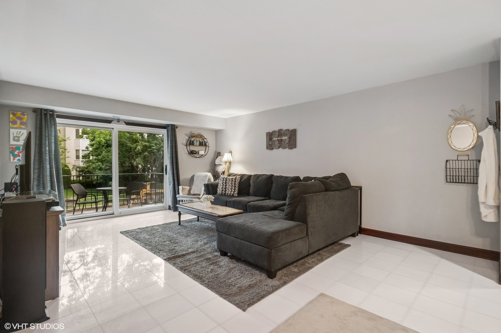 205 Ridge Road, Unit 204 Wilmette, IL 60091 - Photo 2 of 16 a living room with furniture and a large window