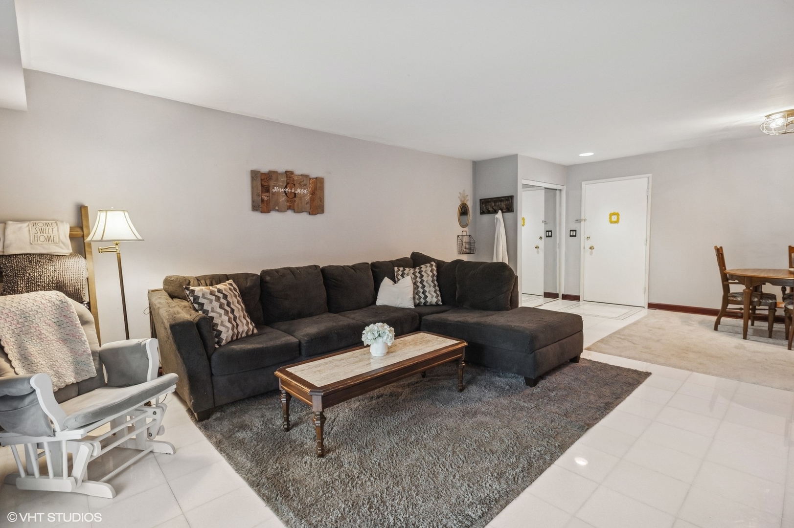 205 Ridge Road, Unit 204 Wilmette, IL 60091 - Photo 4 of 16 a living room with furniture and a couch