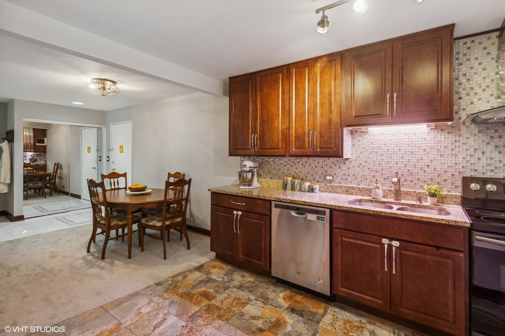 205 Ridge Road, Unit 204 Wilmette, IL 60091 - Photo 5 of 16 a kitchen with a sink and cabinets