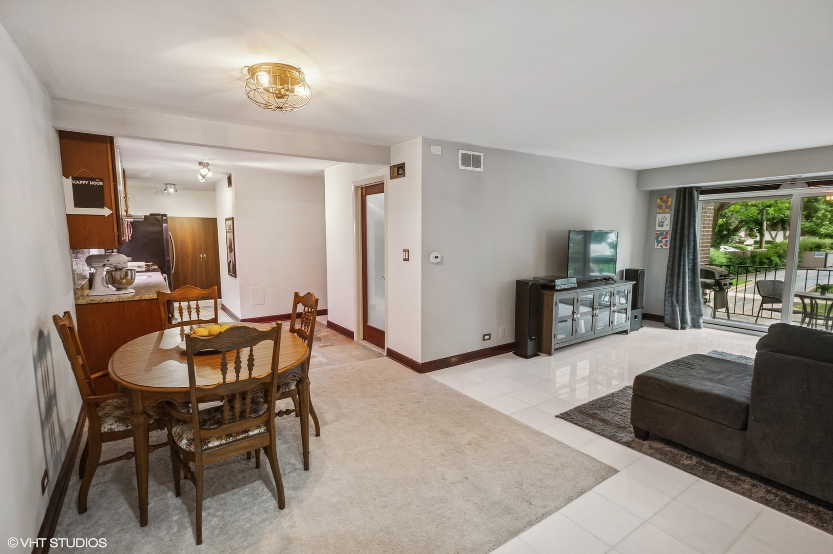 205 Ridge Road, Unit 204 Wilmette, IL 60091 - Photo 6 of 16 a living room with furniture and a large window