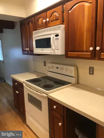 a kitchen with a stove and a microwave