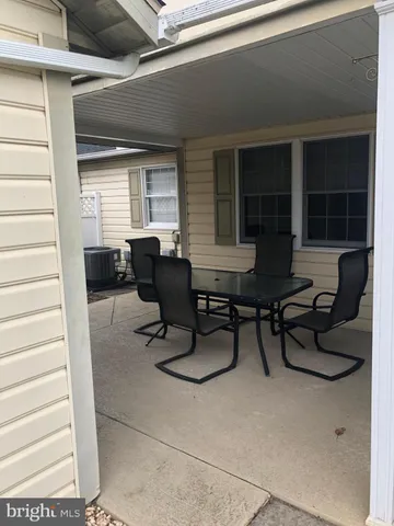 a work room with furniture and a window