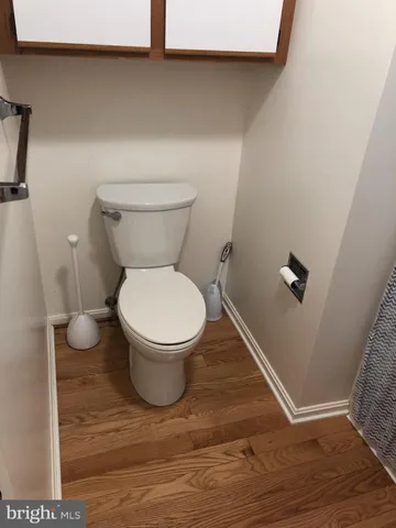 a bathroom with a bath tub with a shower