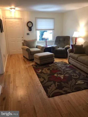 a living room with furniture and a rug