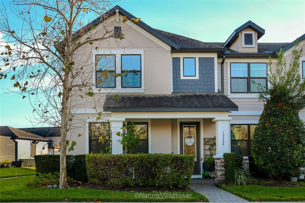 a front view of a house with garden