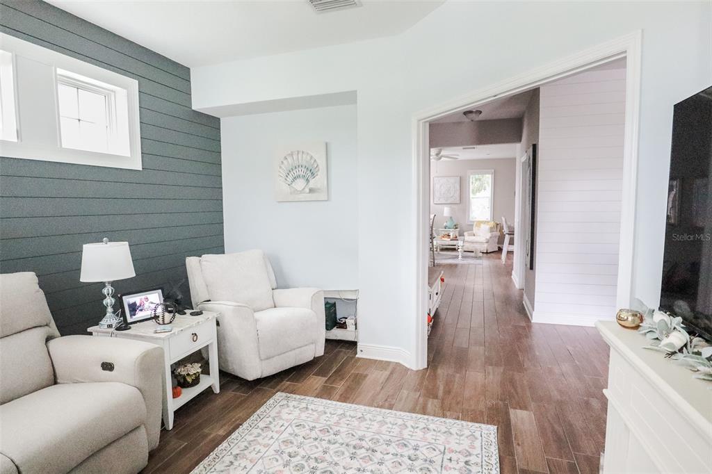 12556 Rangeland Boulevard Odessa, FL 33556 - Photo 14 of 27 a living room with furniture and a flat screen tv