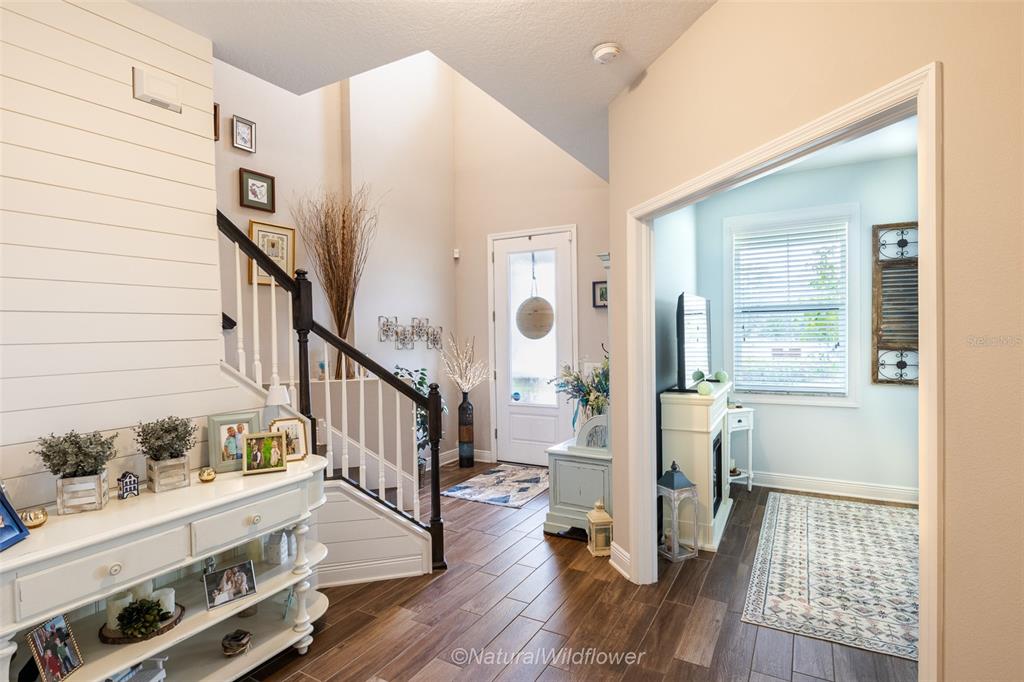 12556 Rangeland Boulevard Odessa, FL 33556 - Photo 16 of 29 a view of entryway with wooden floor and stairs