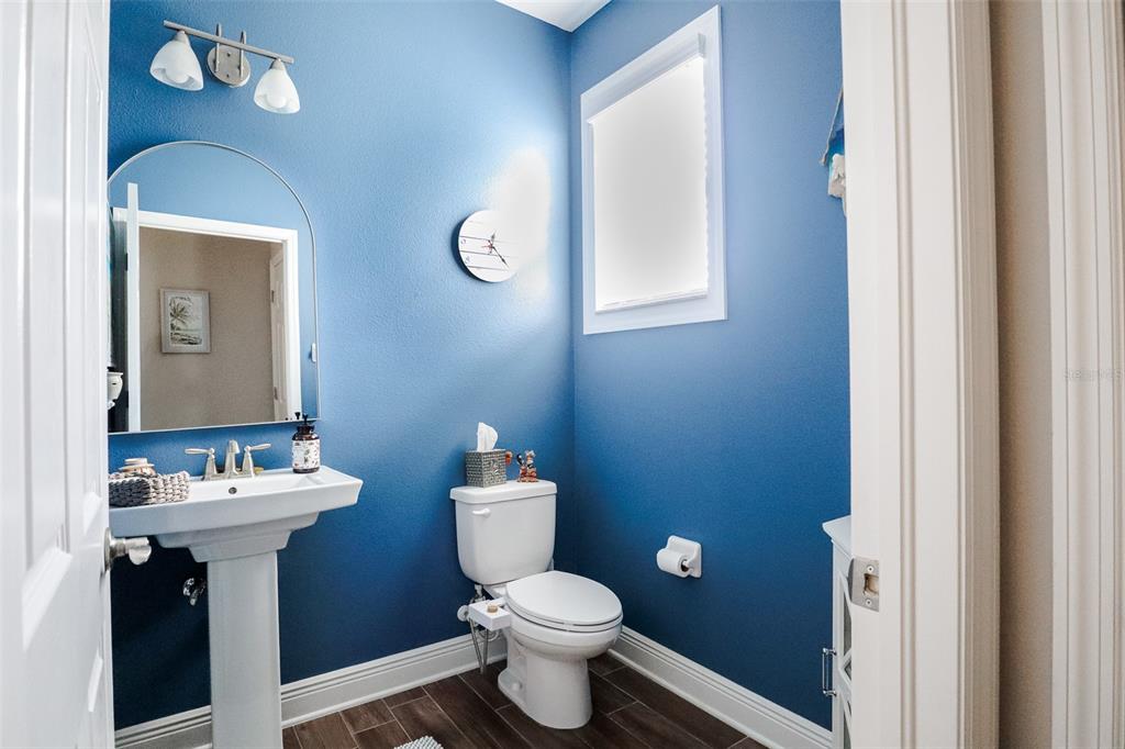12556 Rangeland Boulevard Odessa, FL 33556 - Photo 16 of 27 a bathroom with a sink toilet and a mirror