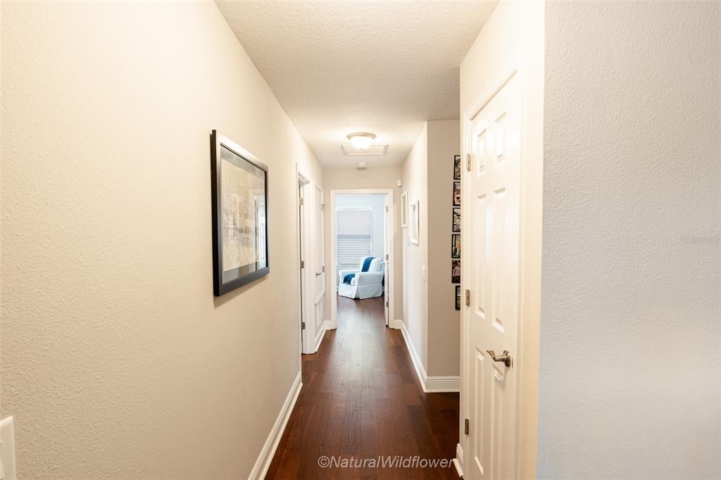 12556 Rangeland Boulevard Odessa, FL 33556 - Photo 17 of 29 a view of a hallway with wooden floor
