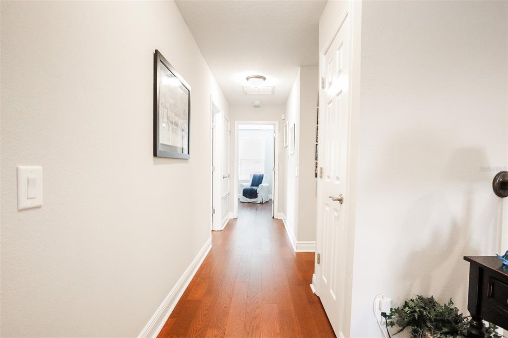 12556 Rangeland Boulevard Odessa, FL 33556 - Photo 18 of 27 a view of a hallway with wooden floor
