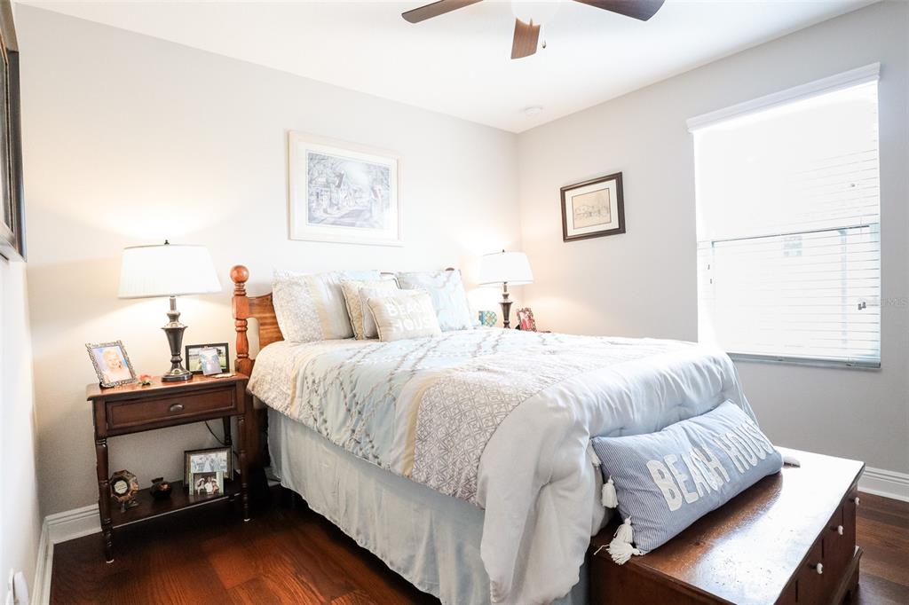 12556 Rangeland Boulevard Odessa, FL 33556 - Photo 21 of 27 a bedroom with a bed and a couch