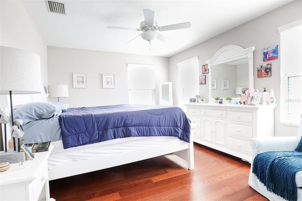12556 Rangeland Boulevard Odessa, FL 33556 - Photo 23 of 27 a living room with a bed furniture and a kitchen view